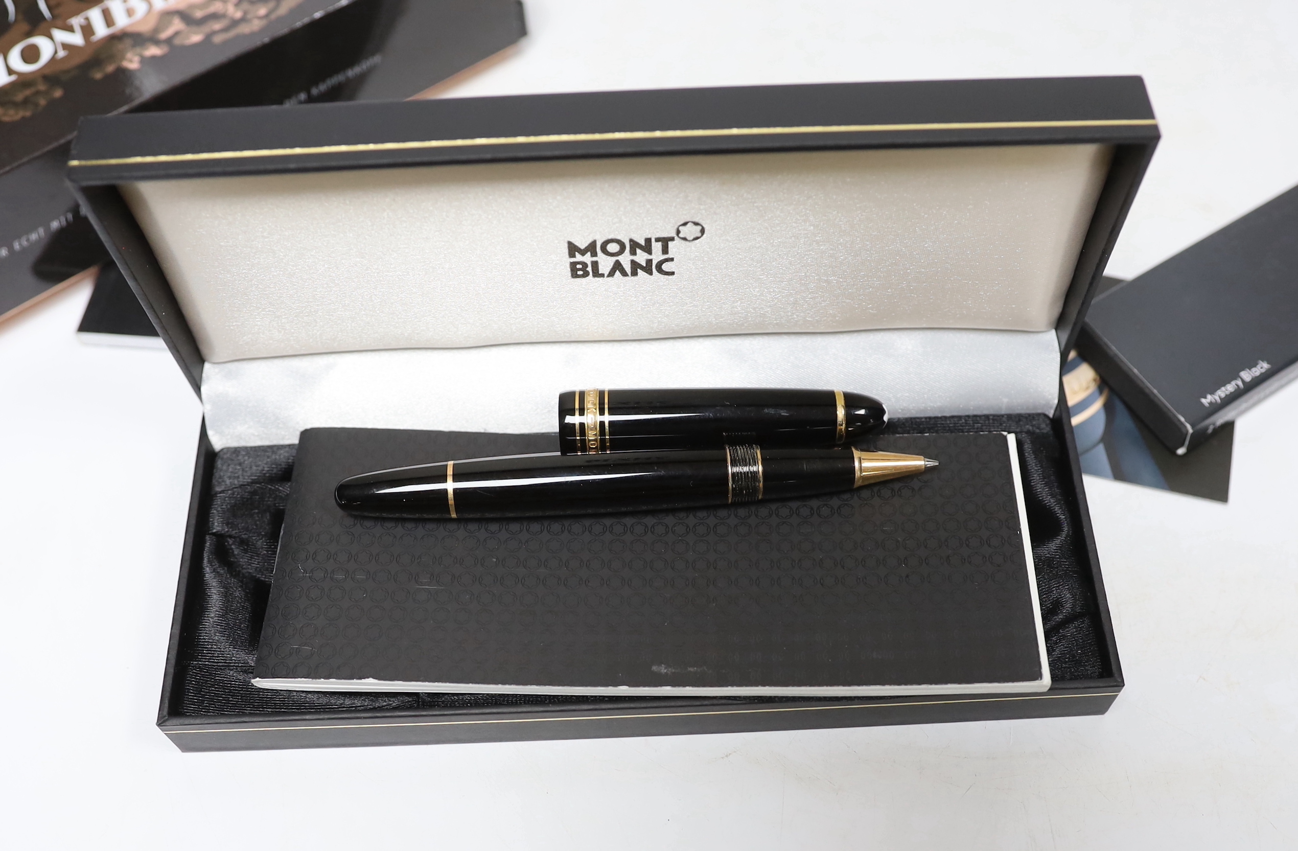 A Montblanc boxed ‘Meistertuck’ fountain pen and a leather cased Montblanc ballpoint pen, a spare box, etc.